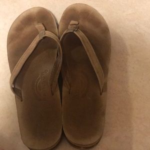 Slightly used rainbow flip flops